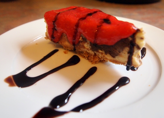 Chocolate Cheesecake with Strawberry Sauce